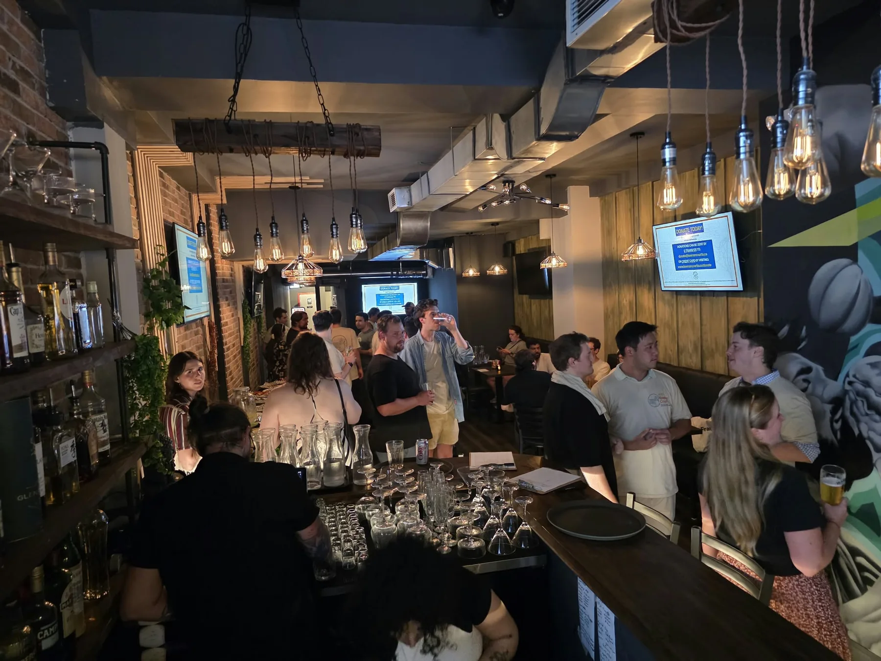 Guests socializing inside Kensington Socials